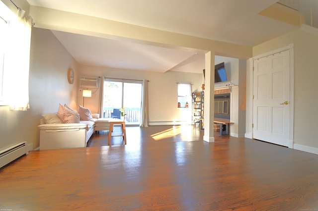 unfurnished living room featuring a wall mounted air conditioner, a baseboard radiator, and a fireplace