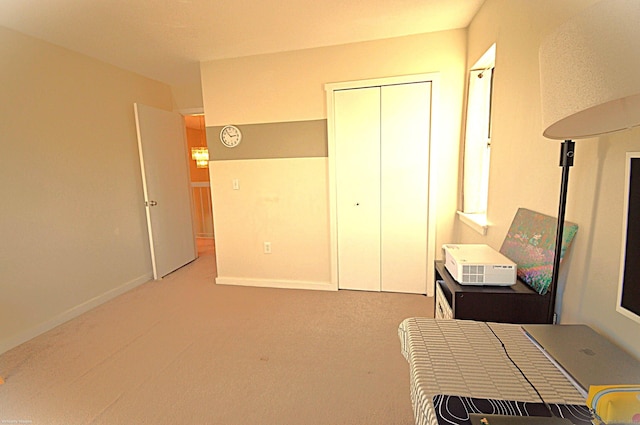 carpeted bedroom featuring a closet