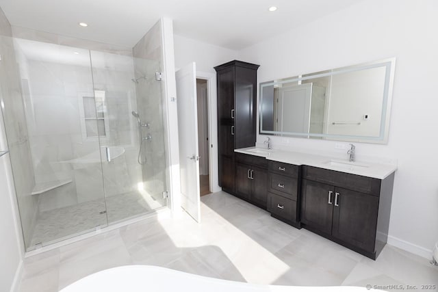 bathroom featuring double vanity, recessed lighting, a sink, and a shower stall