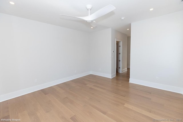 spare room featuring light wood-style flooring, baseboards, ceiling fan, and recessed lighting