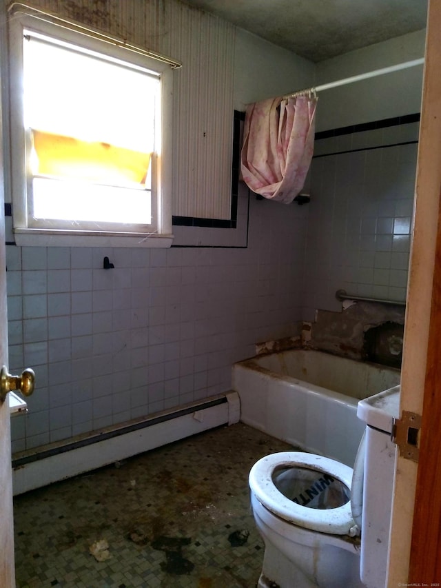 bathroom with toilet, baseboard heating, and shower / bathtub combination with curtain