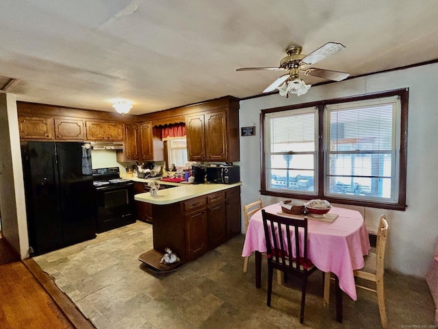 kitchen featuring ceiling fan and black appliances