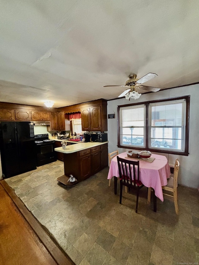 kitchen with ceiling fan and black appliances