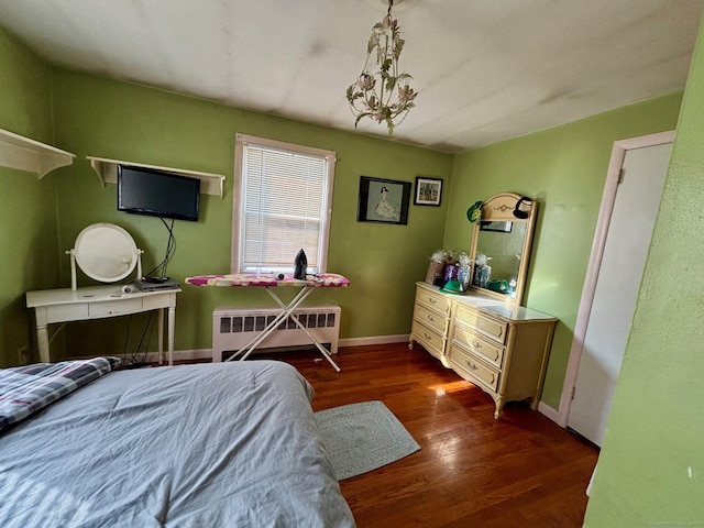 bedroom featuring dark wood-type flooring and radiator