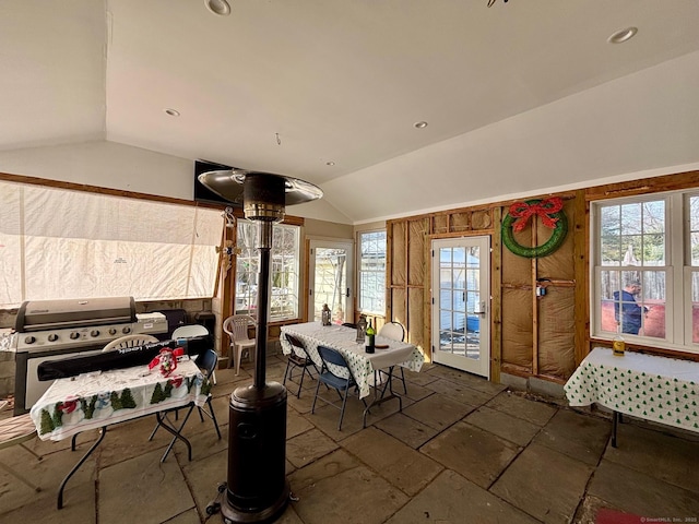 dining room with lofted ceiling