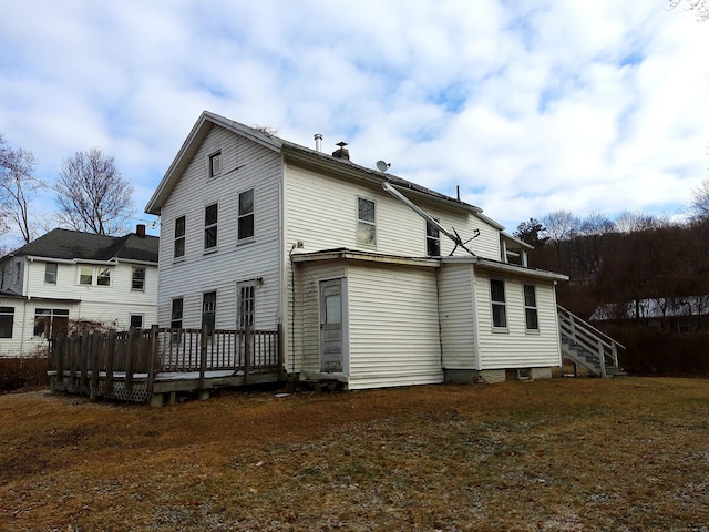 back of house featuring a deck