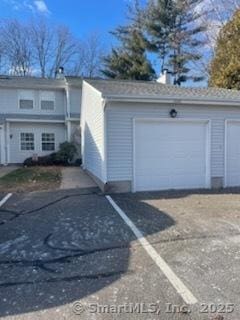 exterior space featuring an outbuilding and a garage