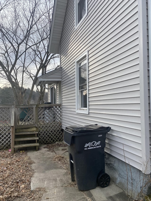 view of side of home with a deck