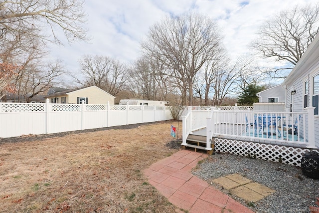 view of yard with a deck