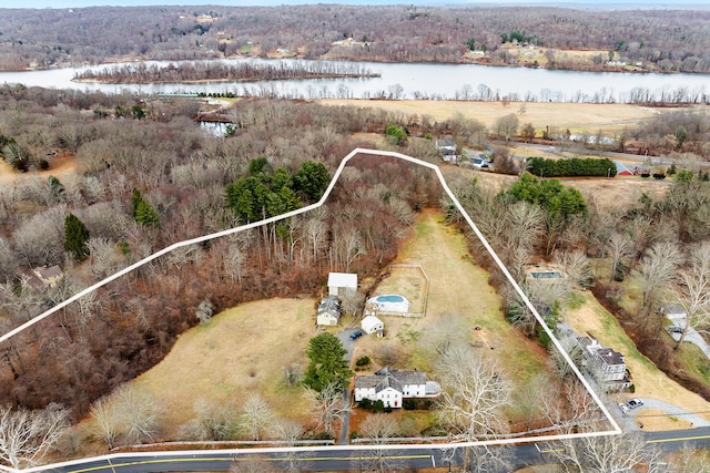 birds eye view of property featuring a water view