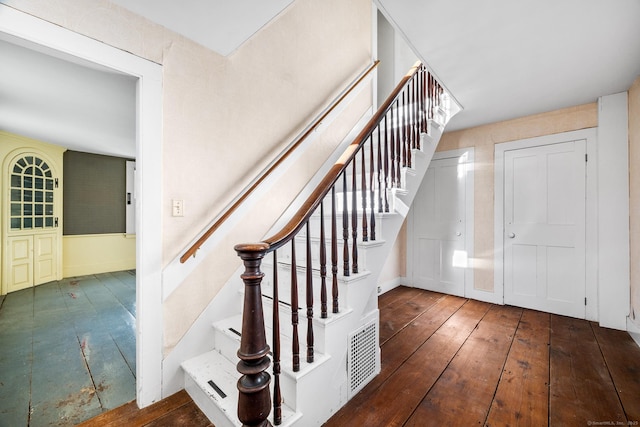 staircase featuring hardwood / wood-style flooring