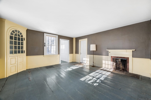 unfurnished living room with dark wood-type flooring