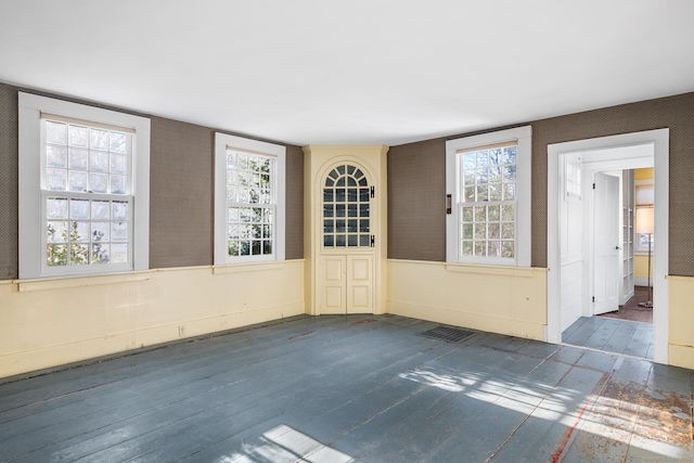 unfurnished room with dark wood-type flooring