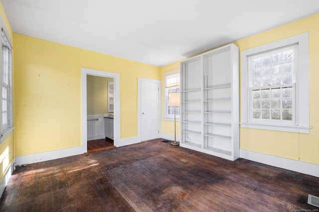 spare room with dark hardwood / wood-style flooring