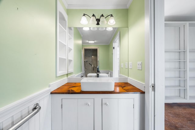 bathroom featuring vanity and crown molding