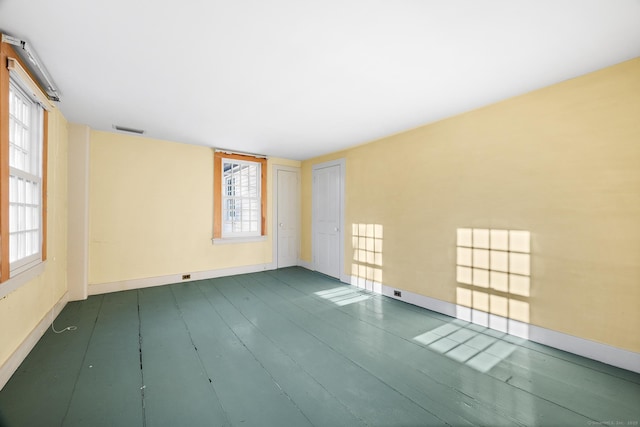 empty room with hardwood / wood-style floors