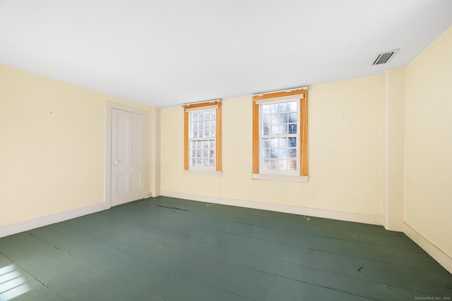 empty room with dark wood-type flooring