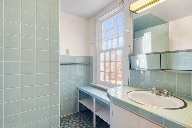 bathroom featuring tile walls and vanity