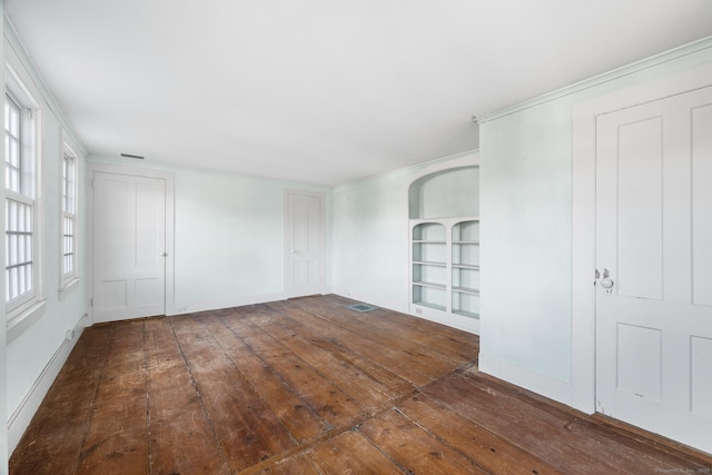 unfurnished room with dark hardwood / wood-style flooring