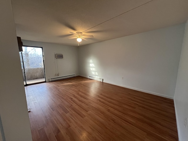 empty room with ceiling fan, a baseboard radiator, and hardwood / wood-style floors