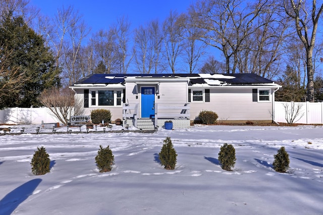 ranch-style house with solar panels