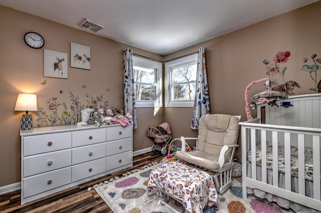 bedroom with hardwood / wood-style flooring