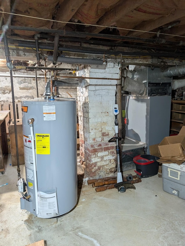 utility room featuring water heater