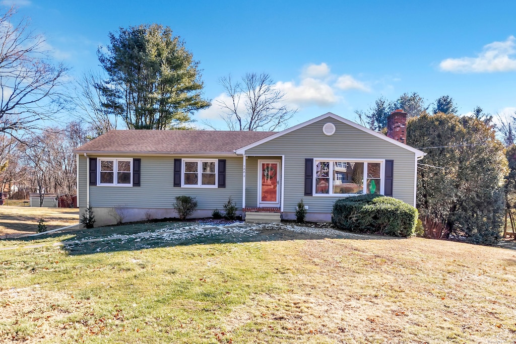 ranch-style house with a front yard