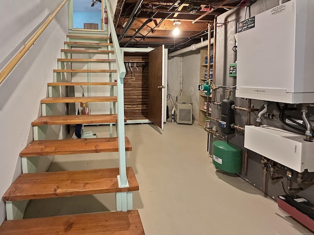 basement featuring tankless water heater