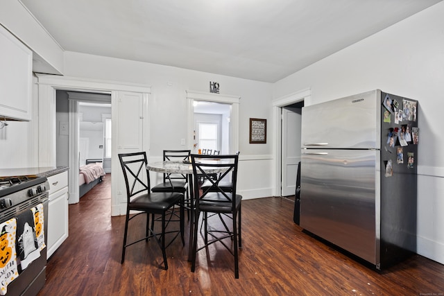 dining room with dark wood-type flooring