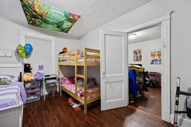 bedroom featuring dark wood-style floors