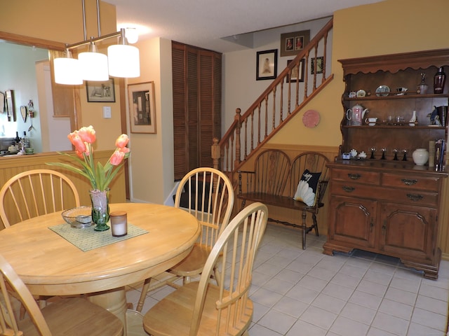 dining area featuring light tile patterned floors