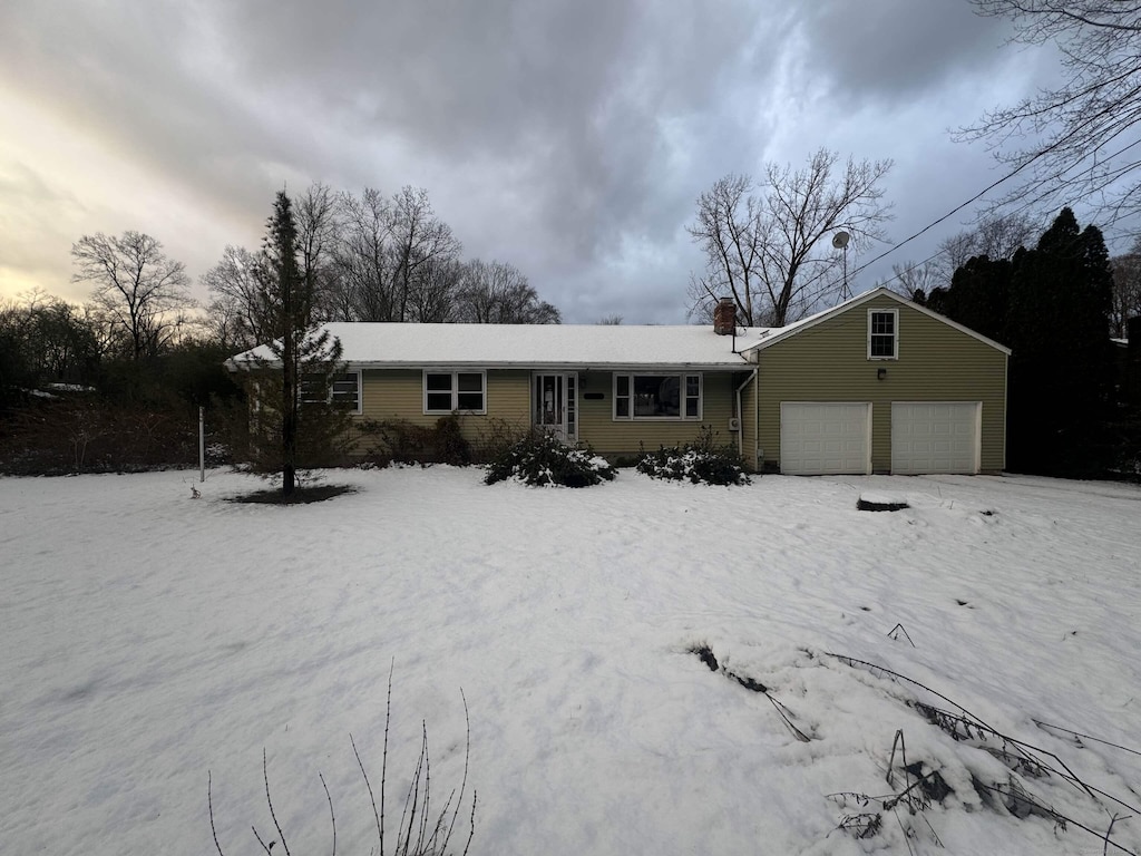 single story home with a garage