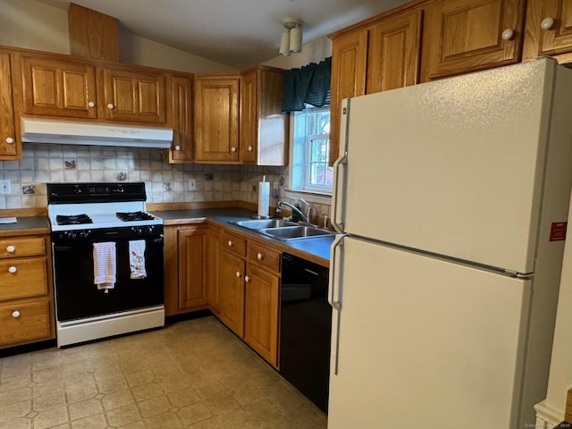 kitchen with dishwasher, white fridge, decorative backsplash, range with gas stovetop, and sink