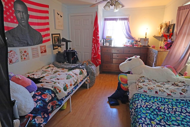 bedroom featuring ceiling fan and light hardwood / wood-style floors