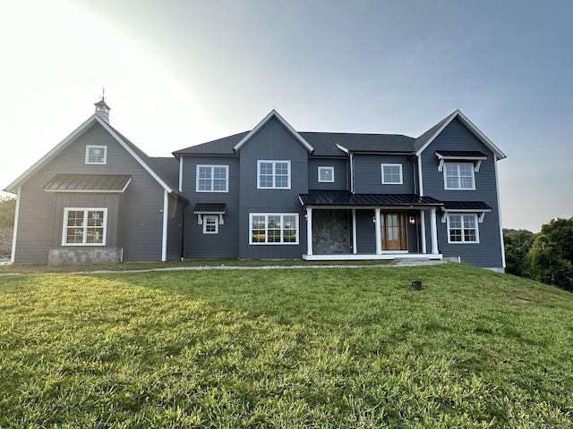 view of front property with a porch and a front yard