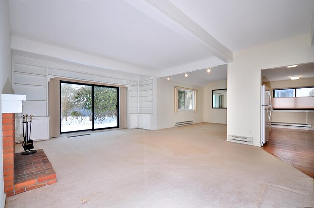 unfurnished living room featuring light carpet, a brick fireplace, beam ceiling, and a baseboard radiator