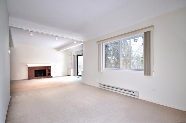 unfurnished living room featuring a baseboard heating unit, a fireplace, and light colored carpet