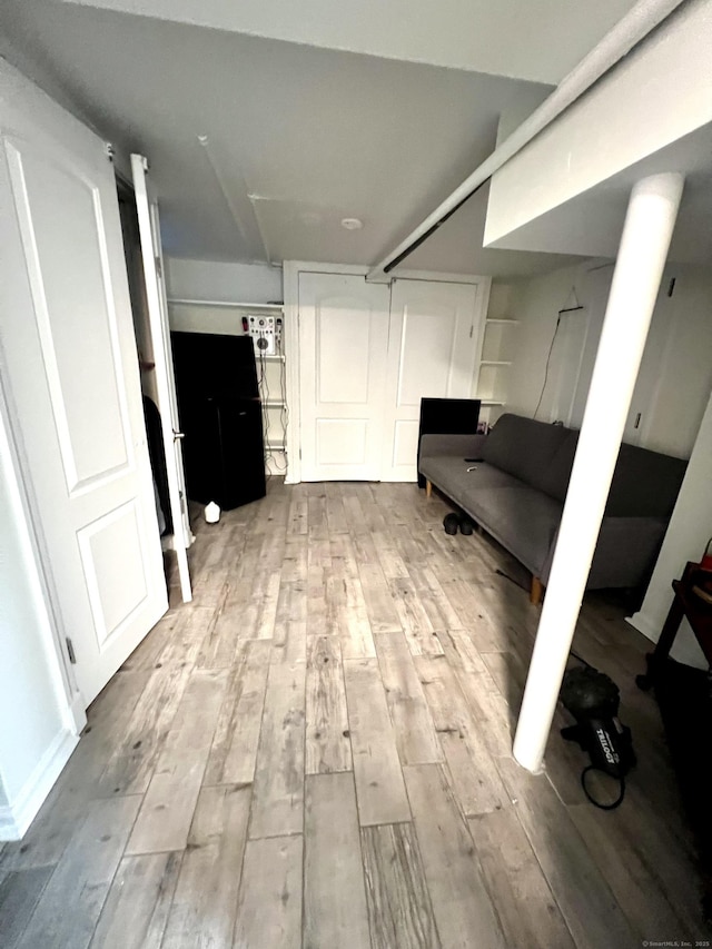 corridor featuring light hardwood / wood-style flooring