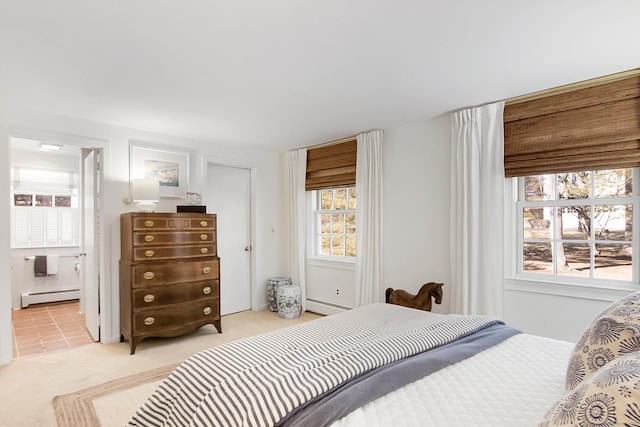 carpeted bedroom featuring a baseboard radiator