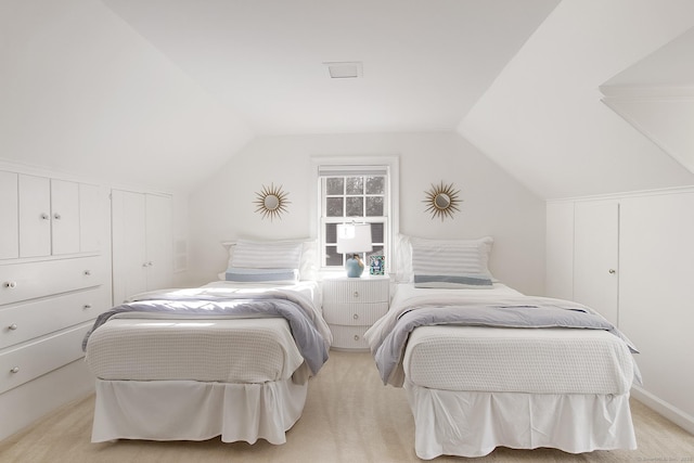 carpeted bedroom featuring lofted ceiling