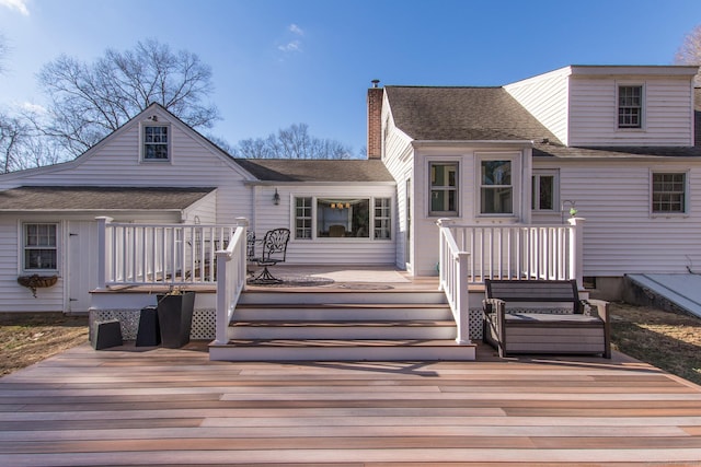 back of property featuring a deck