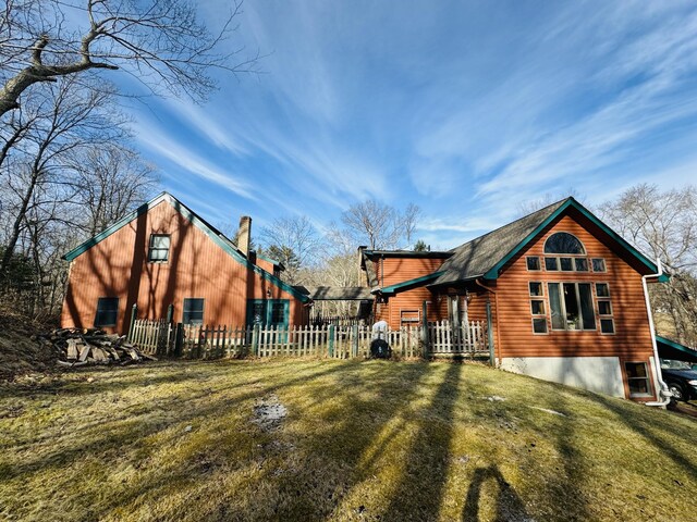 view of home's exterior featuring a lawn