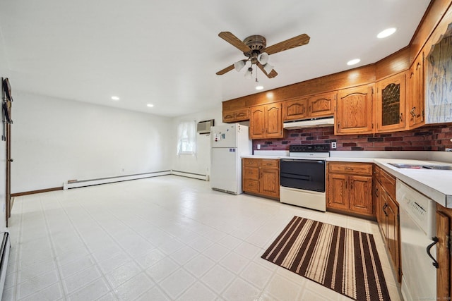 kitchen with white appliances, decorative backsplash, a baseboard radiator, and ceiling fan