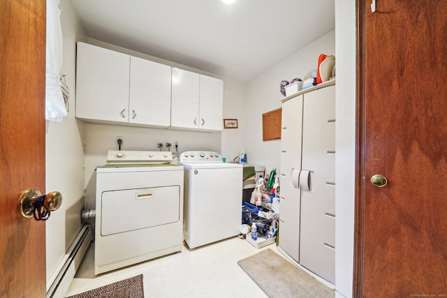 washroom with cabinets, separate washer and dryer, and a baseboard radiator