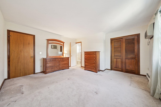 unfurnished bedroom featuring a baseboard heating unit and light carpet