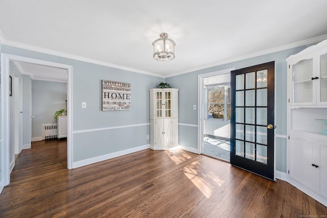 interior space with an inviting chandelier, radiator, dark hardwood / wood-style flooring, and crown molding