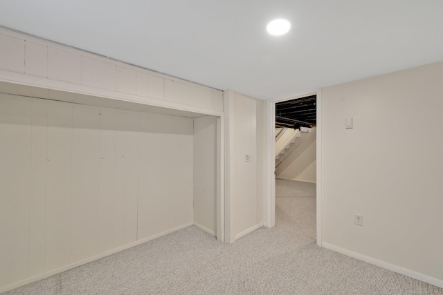 basement with light colored carpet