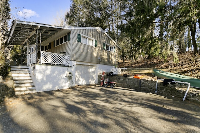 view of property exterior with a garage