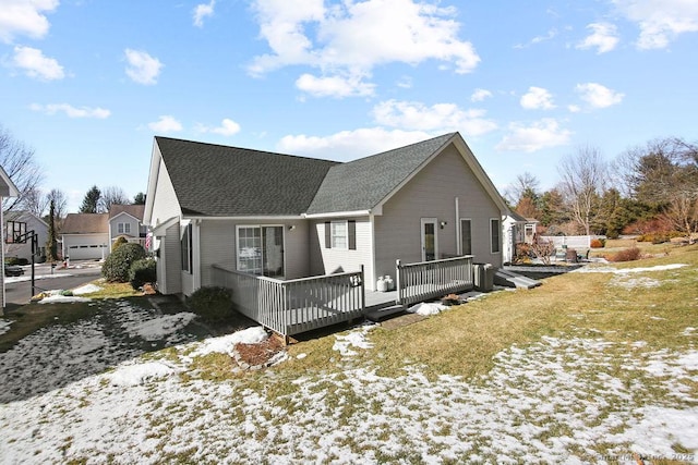 snow covered property featuring a wooden deck and cooling unit